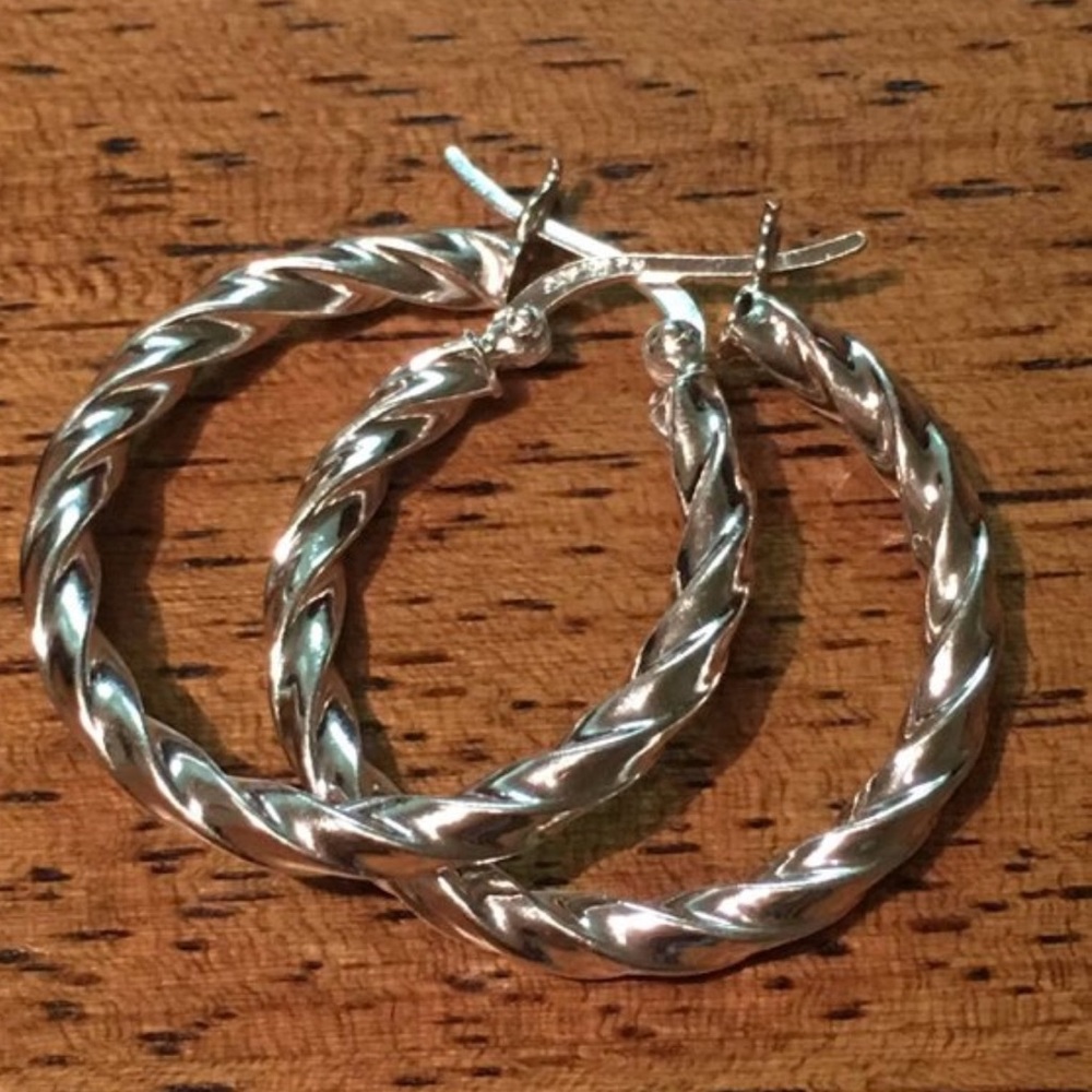 Sterling silver hoop earrings.